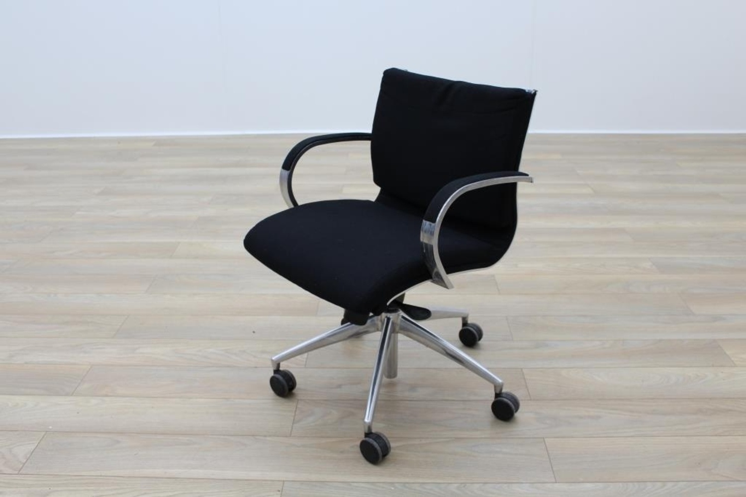 Black used chair with chrome armrest